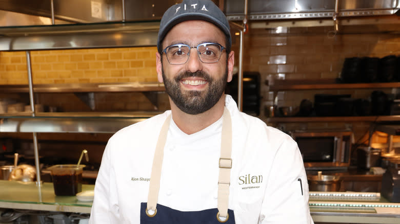 alon shaya smiling in kitchen