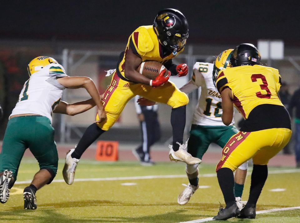 Tulare Union's Brayden Stevenson takes off on a run against Kingsburg during their Central Section Division II high school football quarterfinal playoff game in Tulare, Calif, Friday, Nov. 10, 2023.