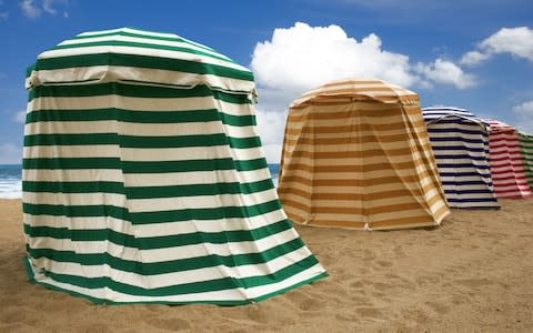 The beaches of Biarritz are famed for their striped tents - Credit: AP/FOTOLIA