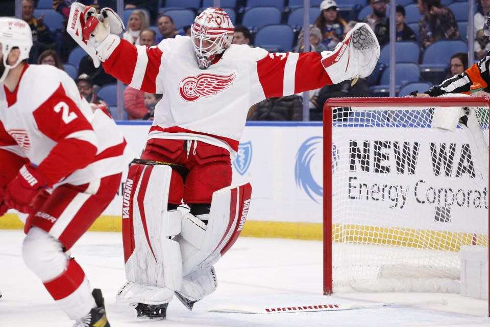Detroit Red Wings goaltender Alex Nedeljkovic (39) loses his balance during the first period of an NHL hockey game against the Buffalo Sabres, Saturday, Nov. 6, 2021, in Buffalo, N.Y. (AP Photo/Jeffrey T. Barnes)