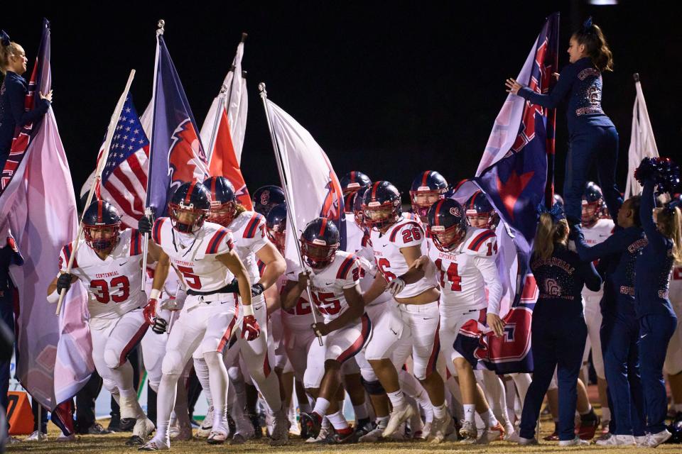 The Centennial Coyotes take the field to face the Chandler Wolves at Chandler High School's Austin Field on Friday, Nov. 25, 2022.
