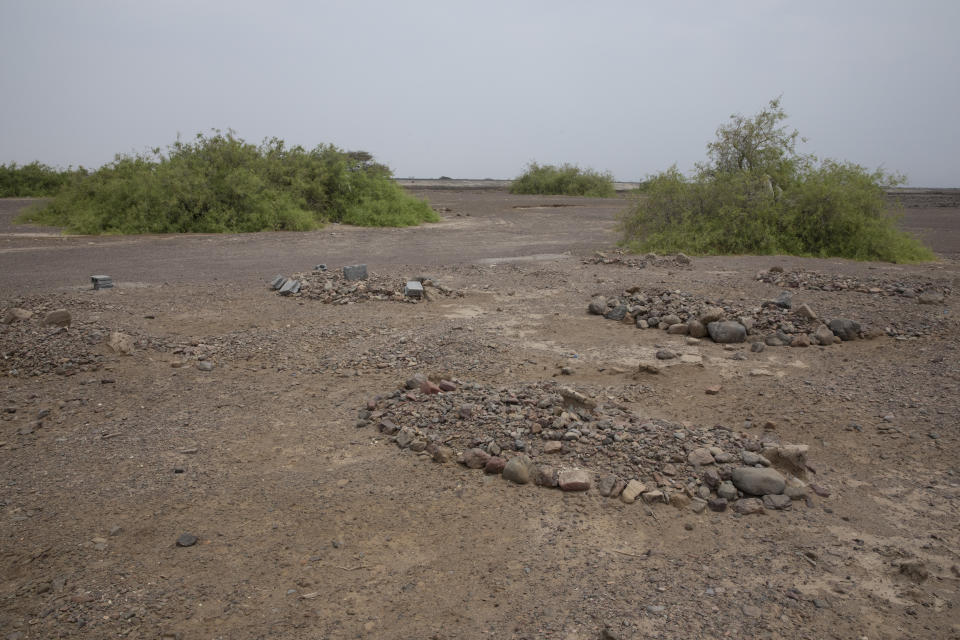 This July 23, 2019 photo, shows the grave of a migrant from Ethiopia buried in Lahj, Yemen. The flow of migrants taking this route has grown. According to the U.N.'s International Organization for Migration, 150,000 arrived in Yemen from the Horn of Africa in 2018, a 50% jump from the year before. The number in 2019 was similar. (AP Photo/Nariman El-Mofty)