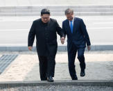 South Korean President Moon Jae-in and North Korean leader Kim Jong Un meet in the truce village of Panmunjom inside the demilitarized zone separating the two Koreas, South Korea, April 27, 2018. Korea Summit Press Pool/Pool via Reuters