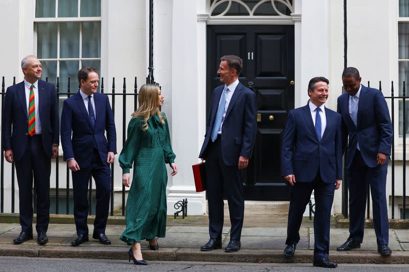 British Chancellor of the Exchequer Jeremy Hunt holds the budget box on Downing Street in London