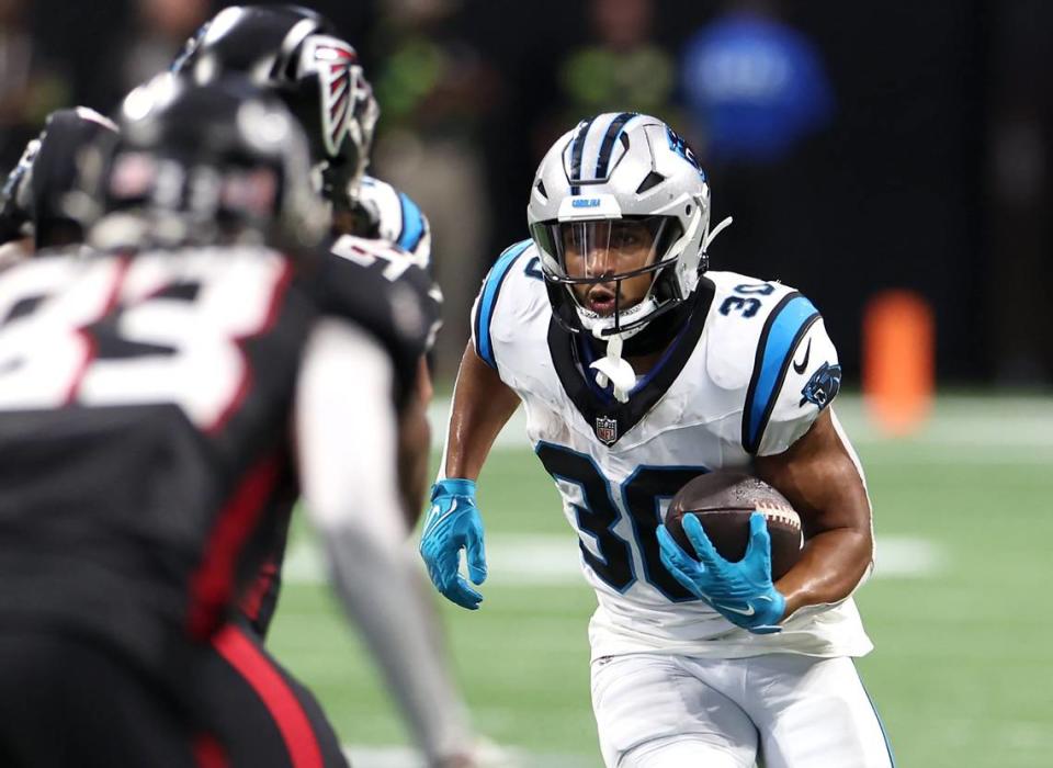 Carolina Panthers running back Chuba Hubbard looks for a hole to break through the Atlanta Falcons defense during second quarter action at Mercedes-Benz Stadium in Atlanta, GA on Sunday, September 10, 2023. 