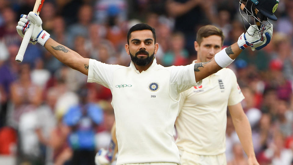 Virat Kohli celebrates scoring his century. Image: Getty