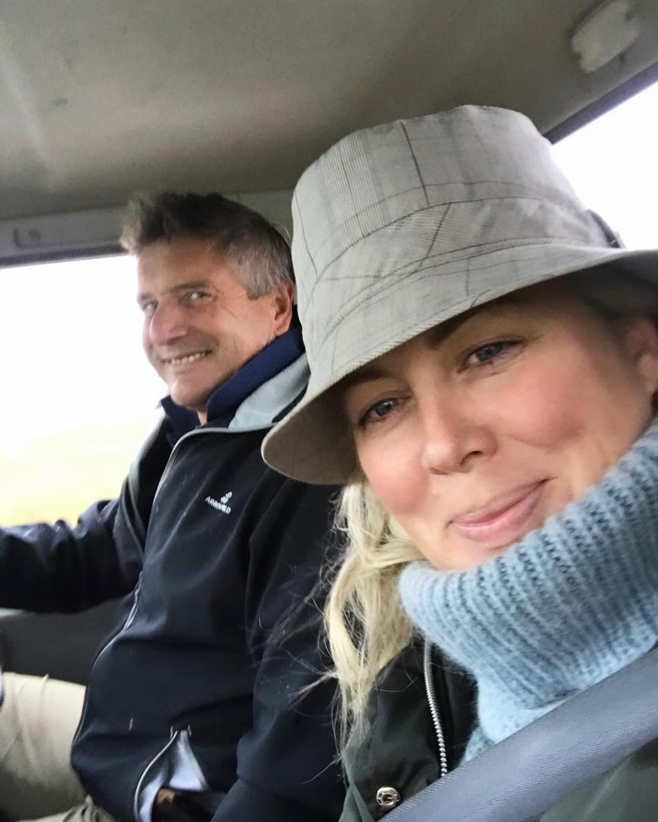 Former Sunrise co-host Sam Armytage sitting next to her husband Richard Lavender in a car