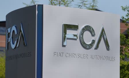 FILE PHOTO: A Fiat Chrysler Automobiles (FCA) sign is seen at the U.S. headquarters in Auburn Hills, Michigan, U.S. May 25, 2018. REUTERS/Rebecca Cook