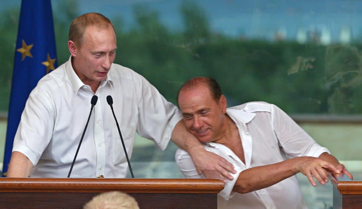 Berlusconi and Putin joke during a 2003 press conference in Sardinia (AFP/Getty)