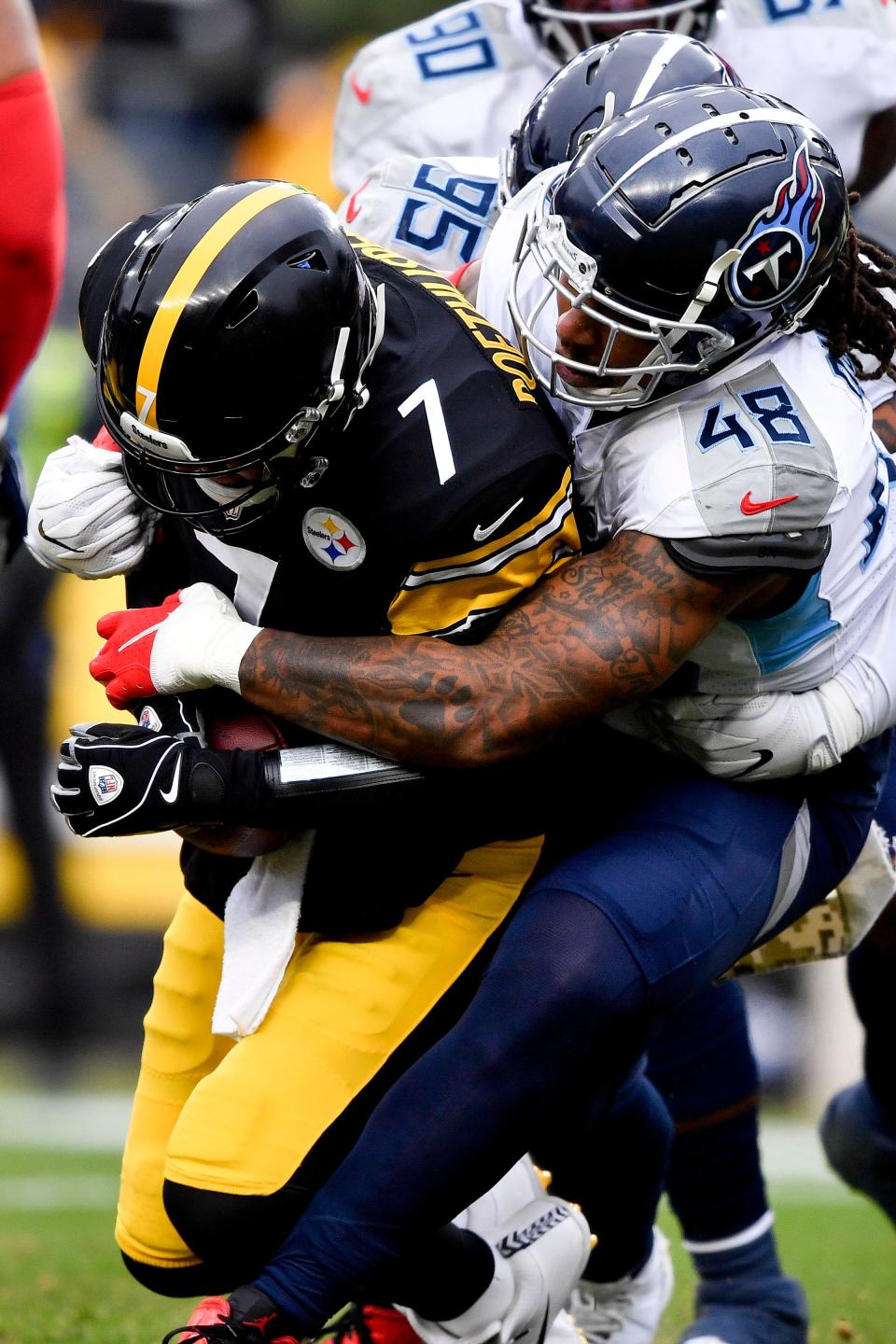 Tennessee Titans outside linebacker Bud Dupree (48) sacks Pittsburgh Steelers quarterback Ben Roethlisberger (7) during the third quarter at Heinz Field Sunday, Dec. 19, 2021 in Pittsburgh, Pa. 