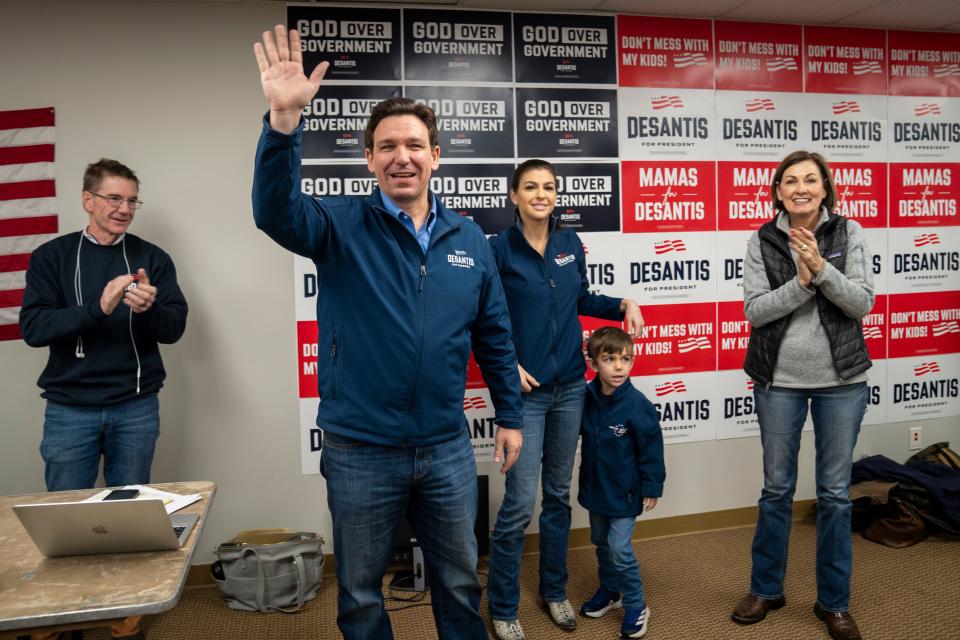 Florida Gov. Ron Desantis is accompanied by his wife Casey, his son Mason, and Iowa Gov. Kim Reynolds during a stop at a DeSantis campaign office in Urbandale, Iowa, Friday, Jan. 12, 2024.