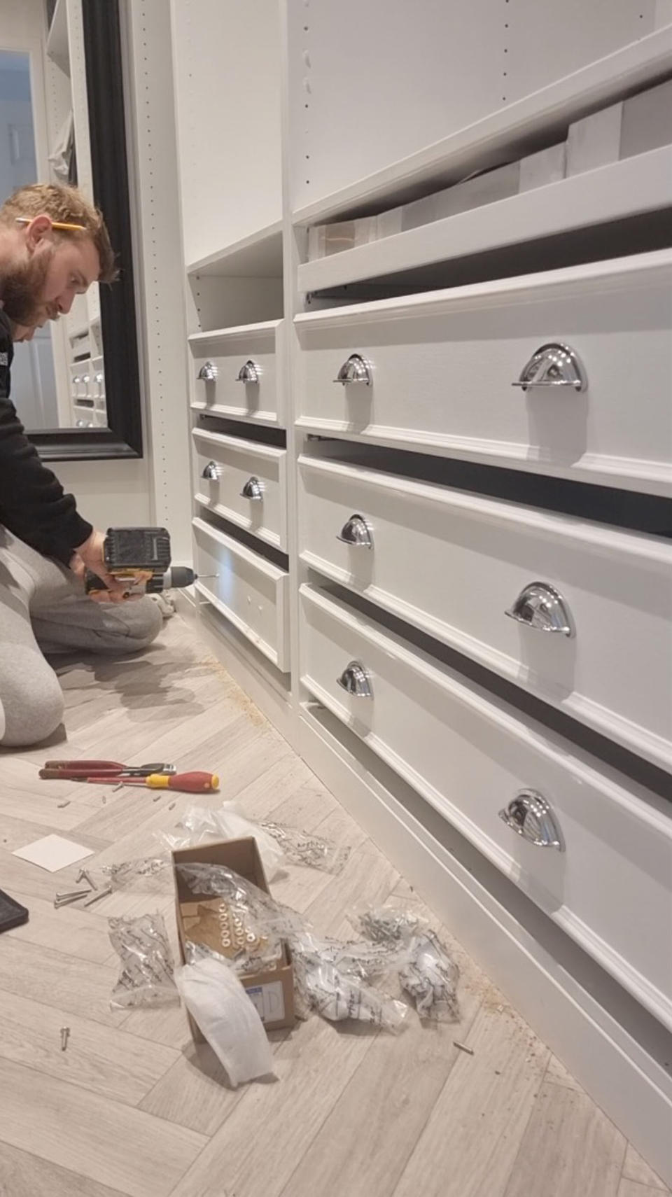 The couple added their own handles to change the look of the IKEA wardrobes. (Caters)