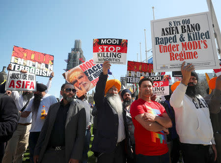 Demonstrators stage a protest against the visit by India's Prime Minister Narendra Modi in Parliament Square, London, Britain, April 18, 2018. REUTERS/Hannah McKay