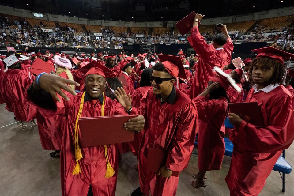 Graduates celebrate during the East Nashville Magnet School Commencement ceremony at Municipal Auditorium Wednesday, May 25, 2022, in Nashville, Tenn. 