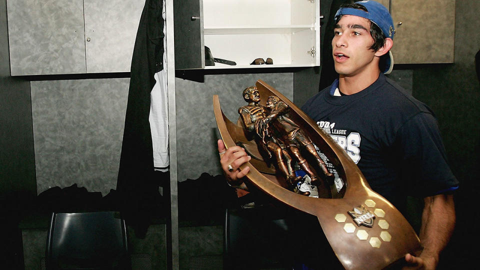 Johnathan Thurston with the NRL premiership trophy in 2004. (Photo by Nick Laham/Getty Images)