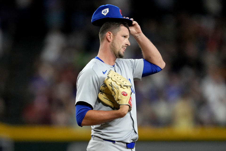 Chicago Cubs pitcher Drew Smyly adjusts his cap after giving up a run against the Arizona Diamondbacks during the eighth inning of a baseball game, Monday, April 15, 2024, in Phoenix. (AP Photo/Matt York)