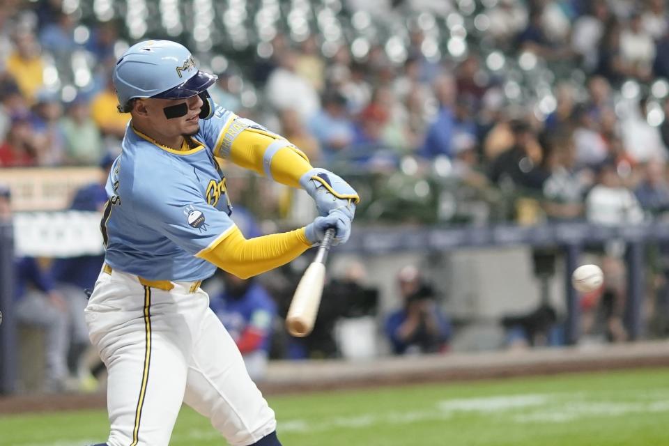 Milwaukee Brewers' William Contreras hits a single during the first inning of a baseball game against the Toronto Blue Jays Tuesday, June 11, 2024, in Milwaukee. (AP Photo/Morry Gash)