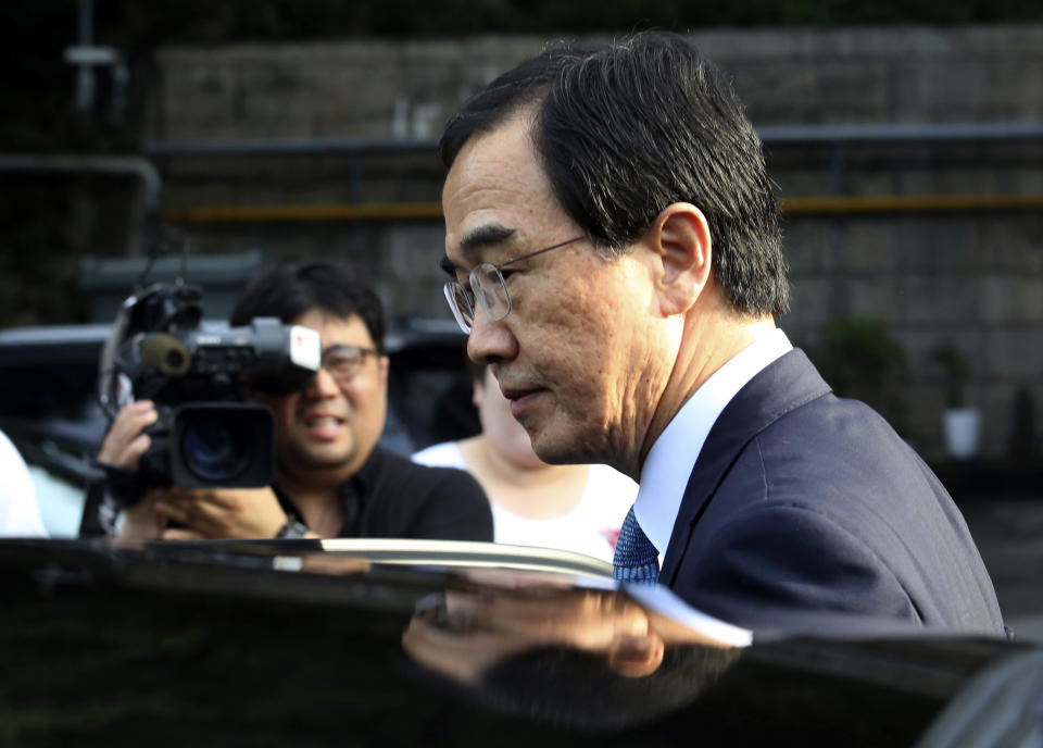 South Korean Unification Minister Cho Myoung-gyon gets into a car to leave for the border village of Panmunjom to attend a meeting between South and North Korea, at the Office of the South Korea-North Korea Dialogue in Seoul, South Korea, Monday, Aug. 13, 2018. (AP Photo/Ahn Young-joon)