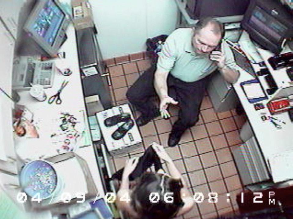 A surveillance video at a Mount Washington McDonald's entered as evidence in court shows Walter Nix Jr. in the restaurant to watch Ogborn, as ordered by the caller. Here, Nix reaches for the apron Ogborn had been using to cover herself after she was strip-searched.