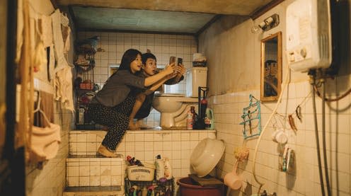 <span class="caption">So-dam Park and Woo-sik Choi in their 'semi-basement' home in Parasite.</span> <span class="attribution"><span class="source">Curzon Artificial Eye</span></span>