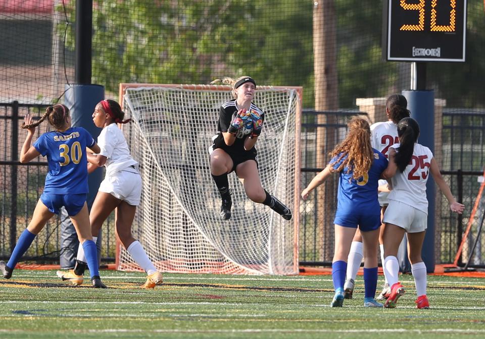St. Vincent's Goal keeper Alana Beddow secures the ball during Tuesday's State playoff game against Holy Innocents on May 4, 2021.