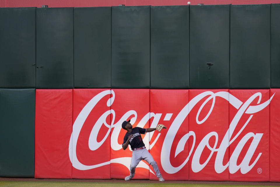 Minnesota Twins center fielder Michael A. Taylor watches an RBI double by Oakland Athletics' Zack Gelof during the third inning of a baseball game Friday, July 14, 2023, in Oakland, Calif. (AP Photo/Godofredo A. Vásquez)