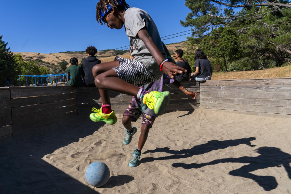 Eli, 12, of Phoenix, Ariz., plays "gaga," an Israeli game popular at U.S. Jewish summer camps, while attending Camp Be'chol Lashon, a sleepaway camp for Jewish children of color, Friday, July 28, 2023, in Petaluma, Calif., at Walker Creek Ranch. (AP Photo/Jacquelyn Martin)