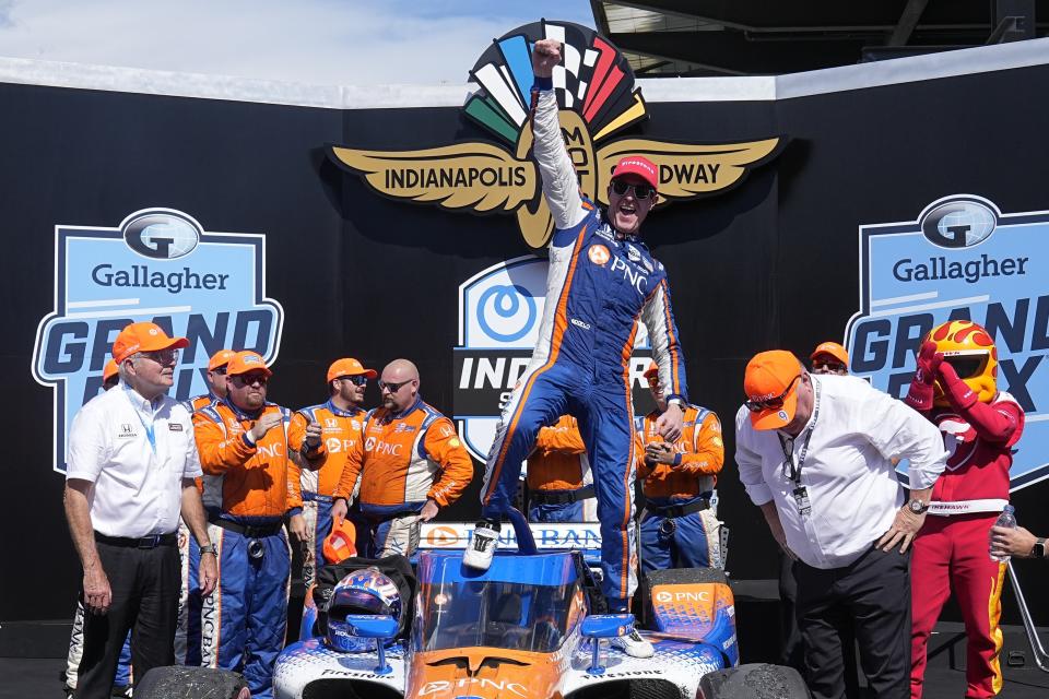 Scott Dixon, of New Zealand, celebrates after winning the IndyCar Indianapolis GP auto race at Indianapolis Motor Speedway, Saturday, Aug. 12, 2023, in Indianapolis. (AP Photo/Darron Cummings)