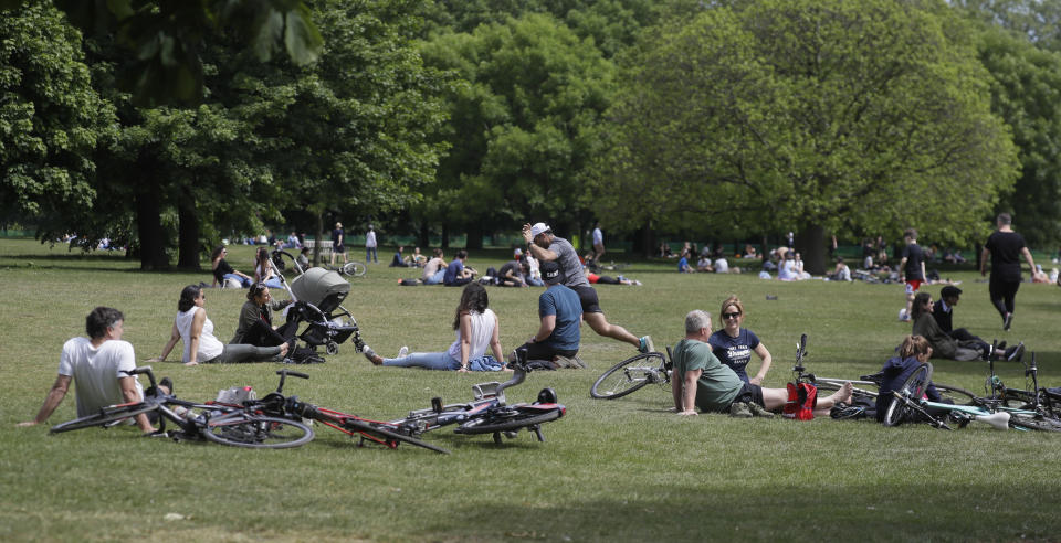 People relax in Hyde Park as lockdown restrictions were relaxed to bring the country out of lockdown amid the coronavirus pandemic, in London, Sunday, May 17, 2020. (AP Photo/Kirsty Wigglesworth)