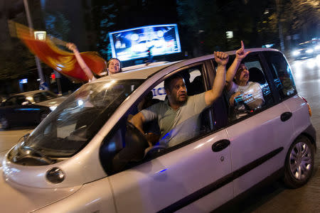 Supporters of Milo Djukanovic, the presidential candidate of the ruling DPS party (Democratic Party of Socialists) celebrate his victory in Podgorica, Montenegro, April 15, 2018. REUTERS/Stevo Vasiljevic