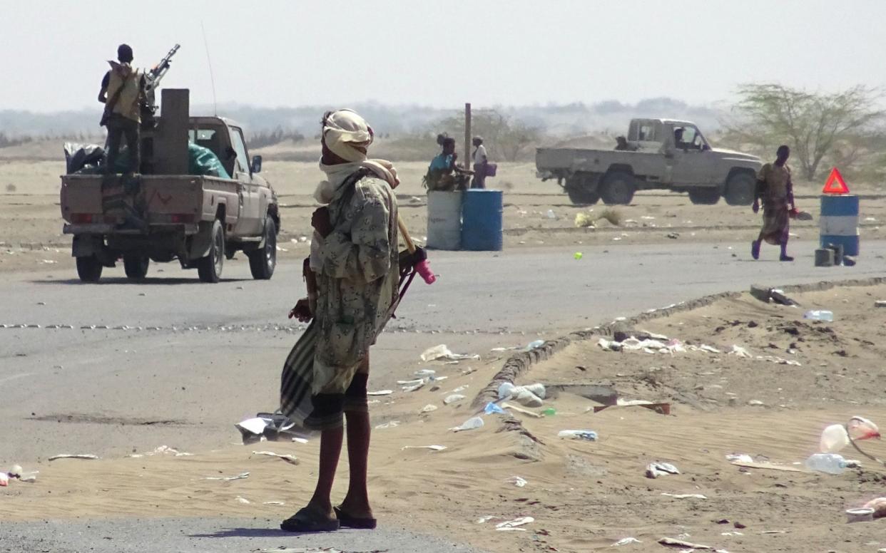 Yemeni pro-government forces gather at a checkpoint in a street on the eastern outskirts of Hodeidah last month, as they battled for the control of the city from Houthi rebels - AFP