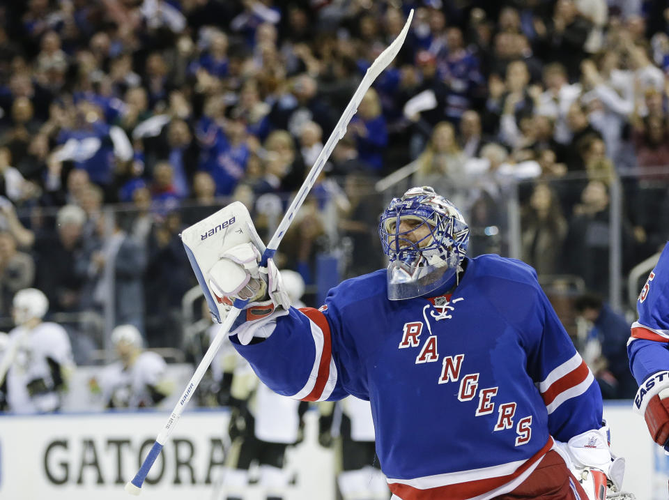 FILE - In this Friday, April 24, 2015, file photo, New York Rangers goalie Henrik Lundqvist (30) celebrates after Game 5 against the Pittsburgh Penguins in the first round of the NHL hockey Stanley Cup playoffs in New York. The Rangers won 2-1. The New York Rangers have bought out the contract of star goaltender Henrik Lundqvist. The Rangers parted with one of the greatest netminders in franchise history on Wednesday, Sept. 30, 2020, when they paid off the final year of his contract. (AP Photo/Frank Franklin II, File)