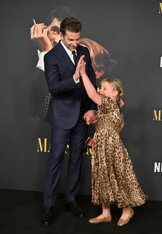 <p>Axelle/Bauer-Griffin/FilmMagic</p> Bradley Cooper and daughter Lea high-five on red carpet