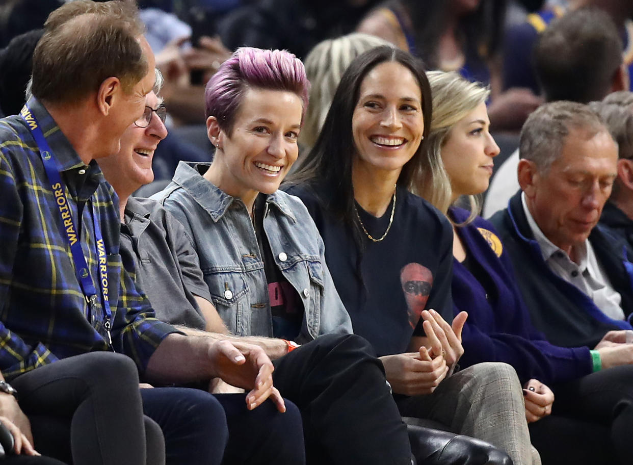 SAN FRANCISCO, CALIFORNIA - OCTOBER 30:  Soccer star Megan Rapinoe and WNBA star Sue Bird watch the Golden State Warriors play against the Phoenix Suns at Chase Center on October 30, 2019 in San Francisco, California.  NOTE TO USER: User expressly acknowledges and agrees that, by downloading and or using this photograph, User is consenting to the terms and conditions of the Getty Images License Agreement. (Photo by Ezra Shaw/Getty Images)