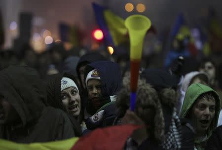 Protesters shout slogans during a demonstration in Bucharest, Romania, February 5, 2017. REUTERS/Stoyan Nenov