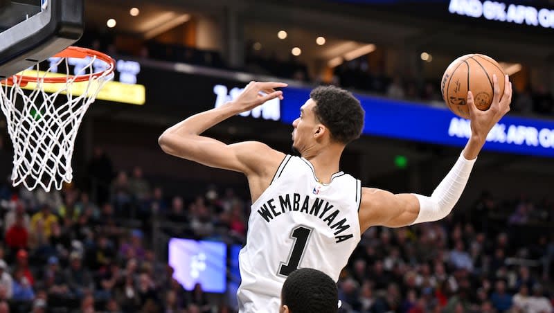 San Antonio Spurs center Victor Wembanyama (1) goes up for a dunk as the Utah Jazz and the San Antonio Spurs play at the Delta Center in Salt Lake City on Wednesday, March 27, 2024.