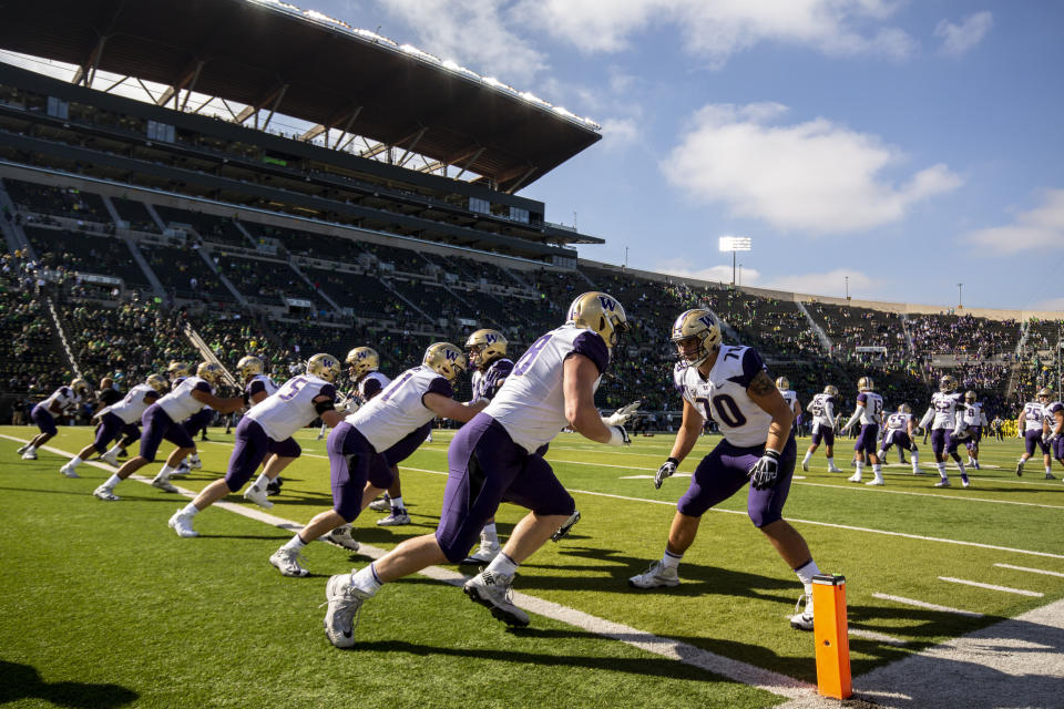 Washington players warm up before playing Oregon in an NCAA college football game in Eugene, Ore., Saturday, Oct. 13, 2018 (AP Photo/Thomas Boyd)