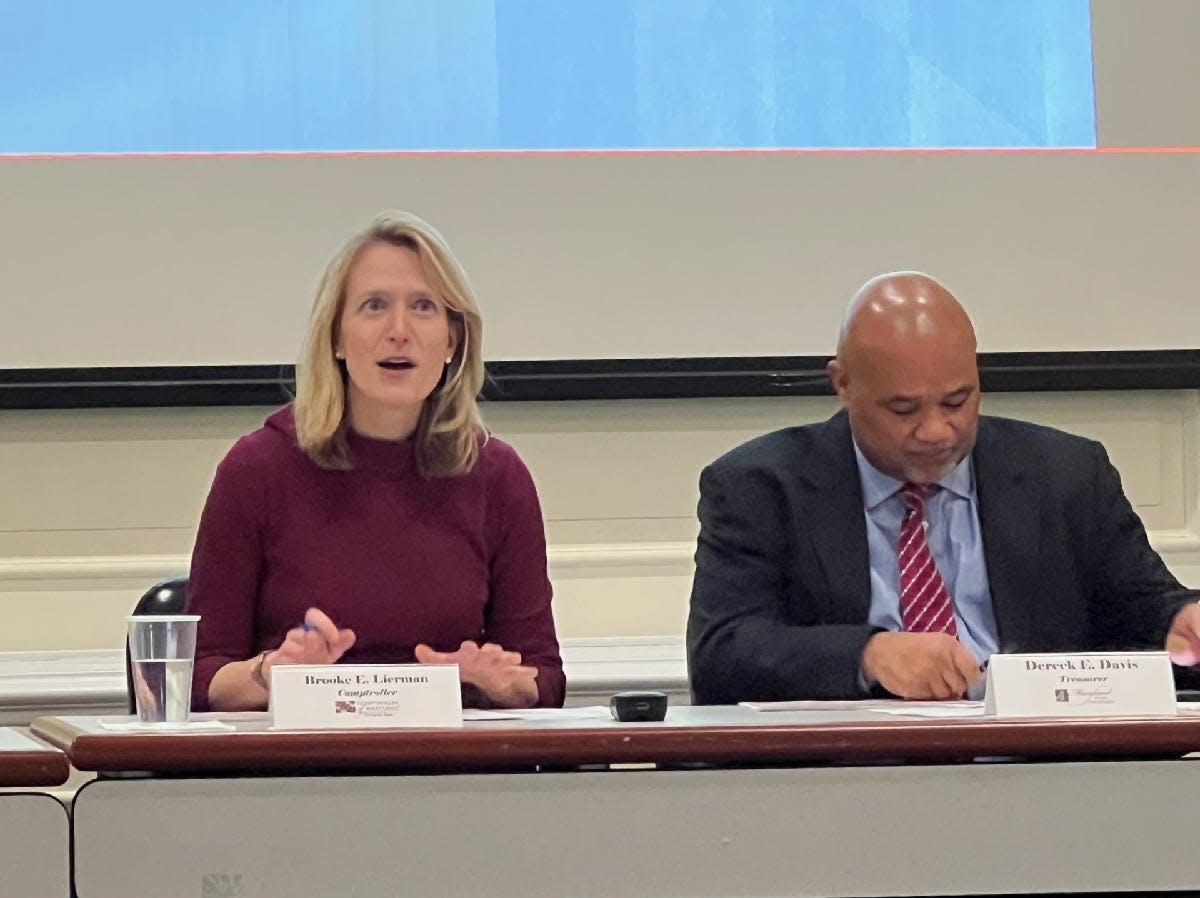 In this file photo, Maryland Comptroller Brooke Lierman, left, speaks during a Board of Revenue Estimates meeting at the Louis L. Goldstein Treasury Building in Annapolis on Dec. 14, 2023. Lierman and Maryland Treasurer Dereck Davis, right, spoke about the importance of small businesses.