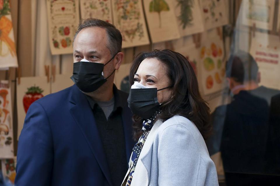 U.S. Vice President-elect Kamala Harris and her husband Doug Emhoff walk in the Downton Holiday Market on November 28, 2020 in Washington, DC. (Photo by Tasos Katopodis/Getty Images)