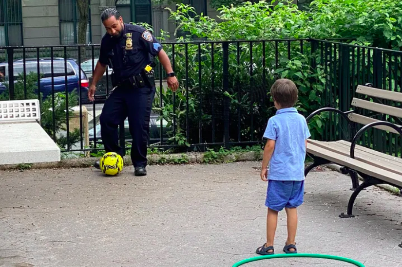 NYPD Youth Coordination Officers took part in a play day at a Harlem park, July 21. (NYPD 26th Precinct / Twitter)