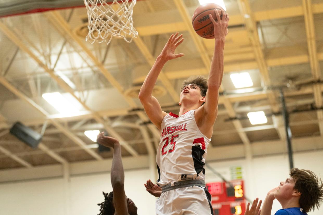 Marshall's Austin Burns takes a shot during a game against Harper Creek at Marshall High School on Friday, Jan. 26, 2023.