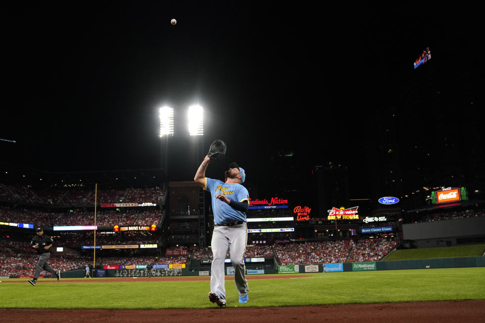 Milwaukee Brewers first baseman Rowdy Tellez catches a popup by St. Louis Cardinals' Yadier Molina in foul territory to end the third inning of a baseball game Tuesday, Sept. 13, 2022, in St. Louis. (AP Photo/Jeff Roberson)