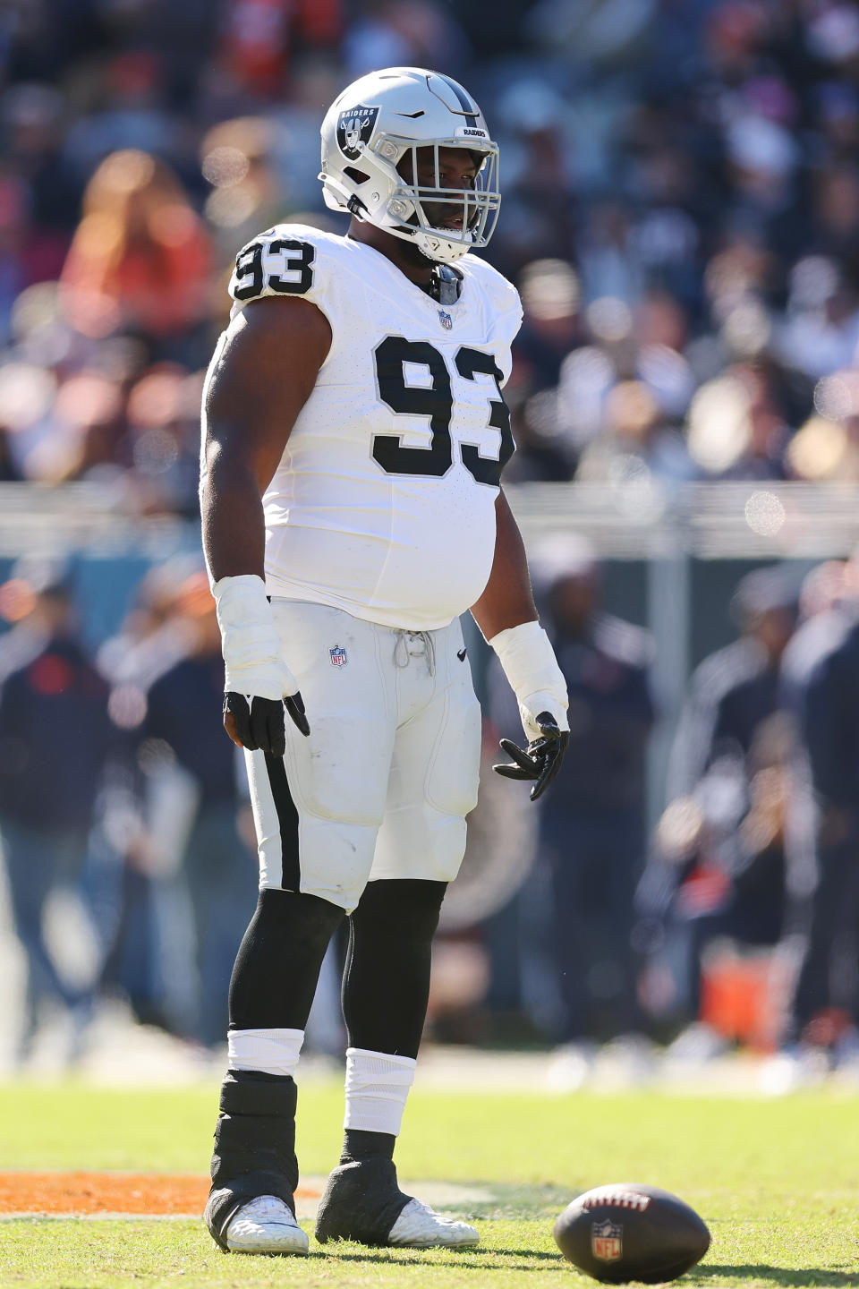CHICAGO, ILLINOIS – OCTOBER 22: Byron Young #93 of the Las Vegas Raiders looks on against the Chicago Bears at Soldier Field on October 22, 2023 in Chicago, Illinois. (Photo by Michael Reaves/Getty Images)