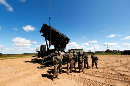 FILE PHOTO: U.S. soldiers stand next to the long-range air dfence system Patriot during Toburq Legacy 2017 air defence exercise in the military airfield near Siauliai, Lithuania, July 20, 2017. REUTERS/Ints Kalnins/File Photo