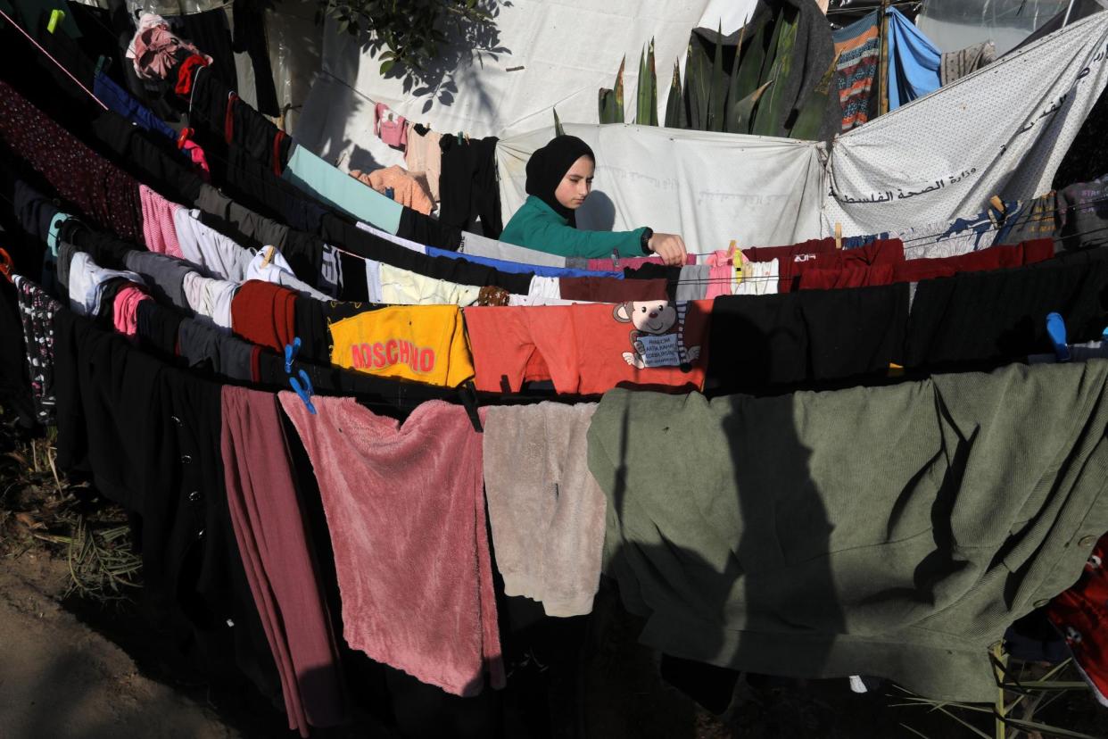 <span>A Palestinian woman hangs her washing out in Khan Younis. For 700,000 women and girls in Gaza their period is a time of pain and humiliation.</span><span>Photograph: Anadolu/Getty Images</span>