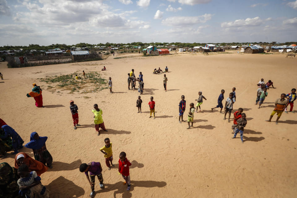 Somali refugee children play outside in an open field at Dadaab refugee camp in northern Kenya Thursday, July 13, 2023. One of the world's largest refugee camps offers a stark example of the global food security crisis with thousands of people fleeing Somalia in recent months to escape drought and extremism but finding little to eat when they arrive at the Dadaab camp in neighboring Kenya. (AP Photo/Brian Inganga)