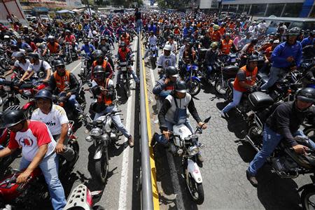 Motorcyclists take part in a protest against possible regulation and schedule bans as a measure to combat insecurity in Caracas January 31, 2014. REUTERS/Jorge Silva