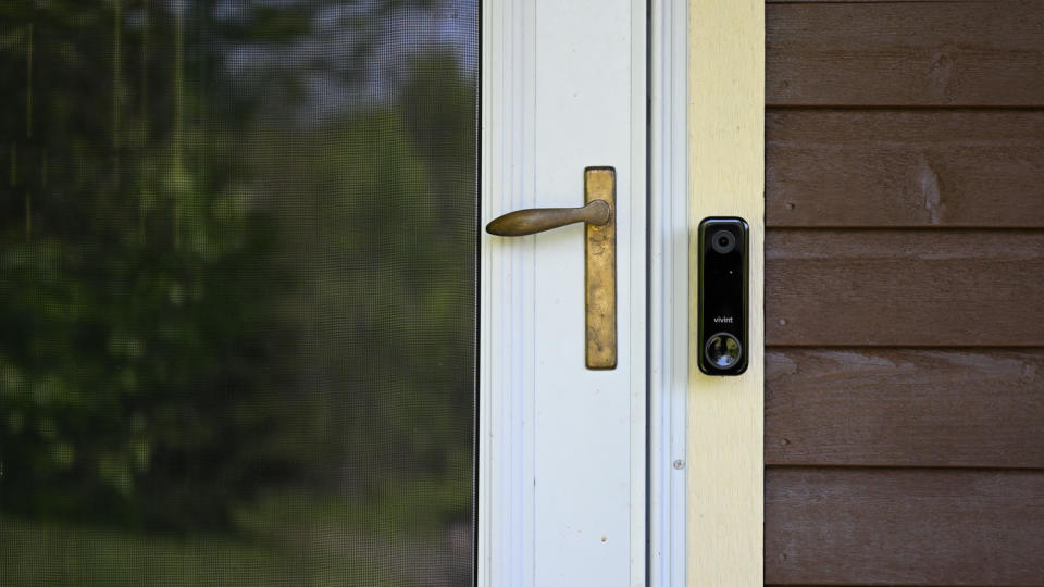 Vivint Doorbell by door on wooden home