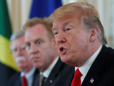 U.S. President Donald Trump speaks as acting Defense Secretary Patrick Shanahan and National Security Advisor John Bolton look on during a meeting with Caribbean leaders at Mar-a-Lago in Palm Beach, Florida, U.S., March 22, 2019. REUTERS/Kevin Lamarque
