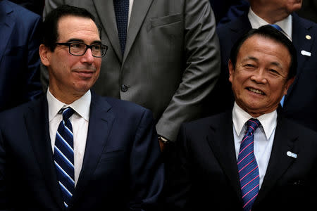 U.S. Treasury Secretary Steven Mnuchin and Japanese Finance Minister Taro Aso attend the IMF and World Bank's 2019 Annual Spring Meetings, in Washington, April 13, 2019. REUTERS/James Lawler Duggan